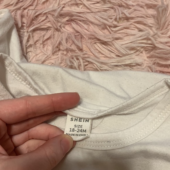 This is a SHEIN first thanksgiving long sleeve onesie. It buttons in the leg. - Picture 3 of 3